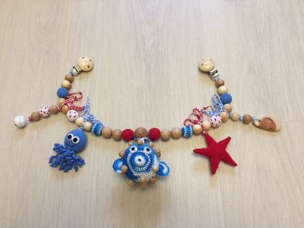 Вязанная растяжка для коляски или кроватки